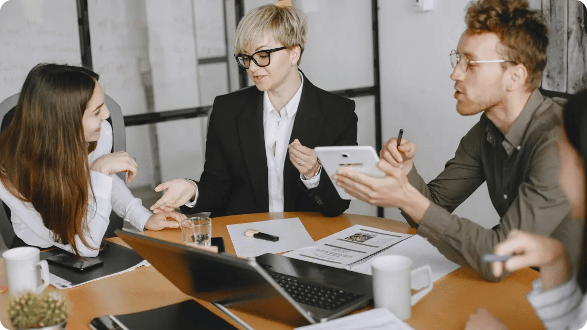 Group of people in a meeting discussing operational dependencies and service continuity.