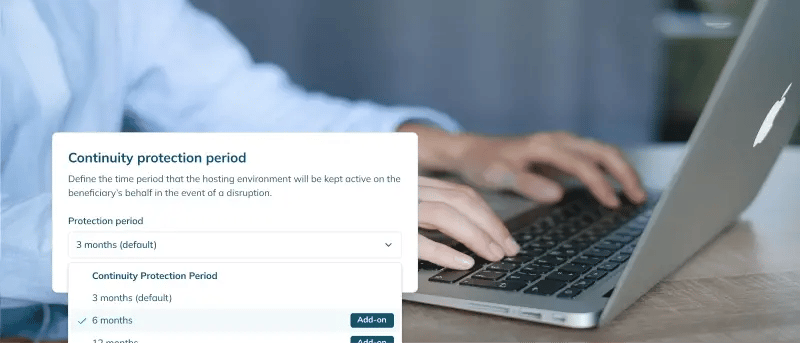 Person working on a laptop with a screenshot of the continuity protection period selector below.