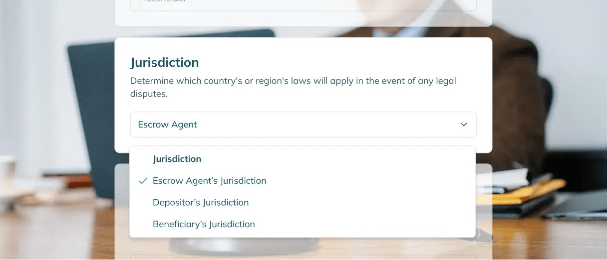 Person working on a laptop with a screenshot of the “Jurisdiction” field overlaid.